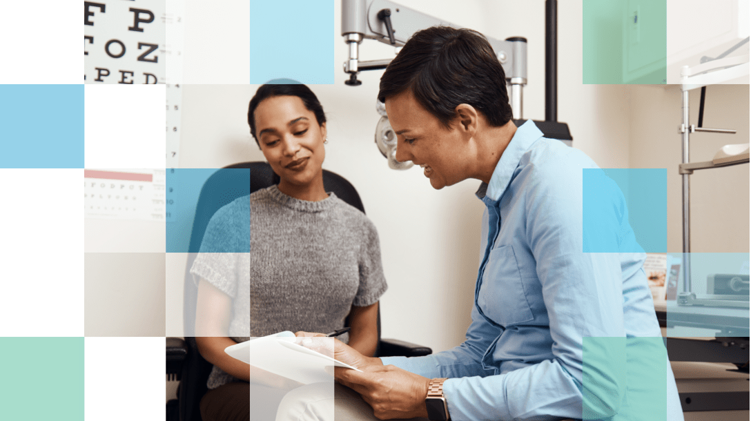 Eye Care Professional in an eye doctor office explaining the treatment plan to a patient