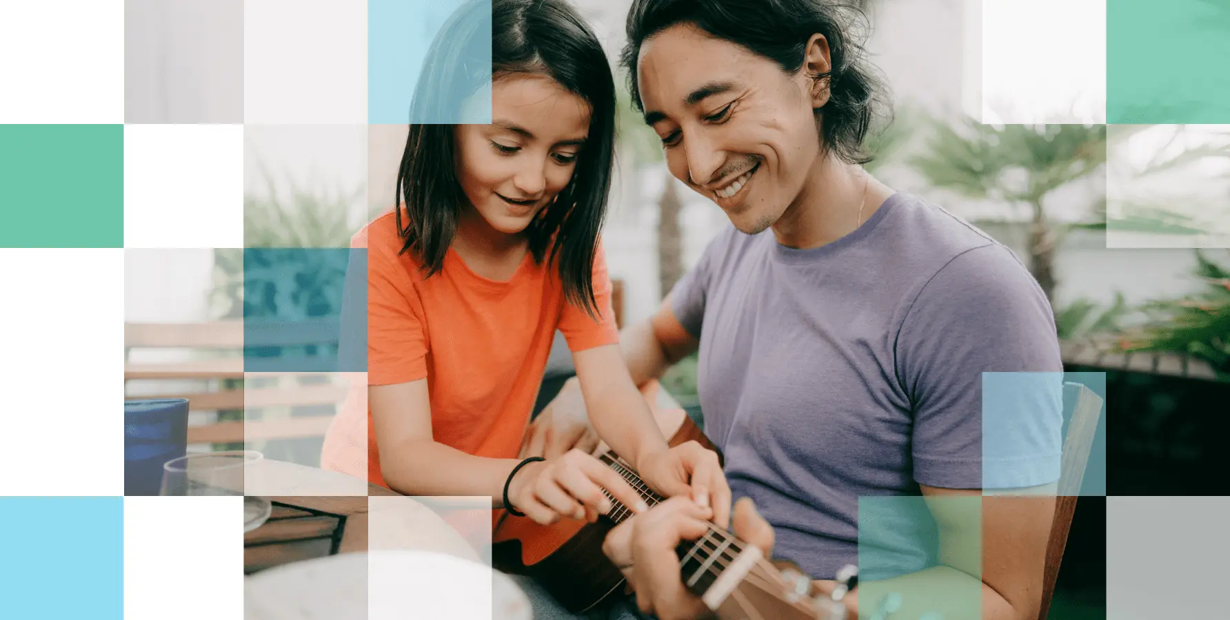 Father and daughter play the guitar after finding a vision product solution